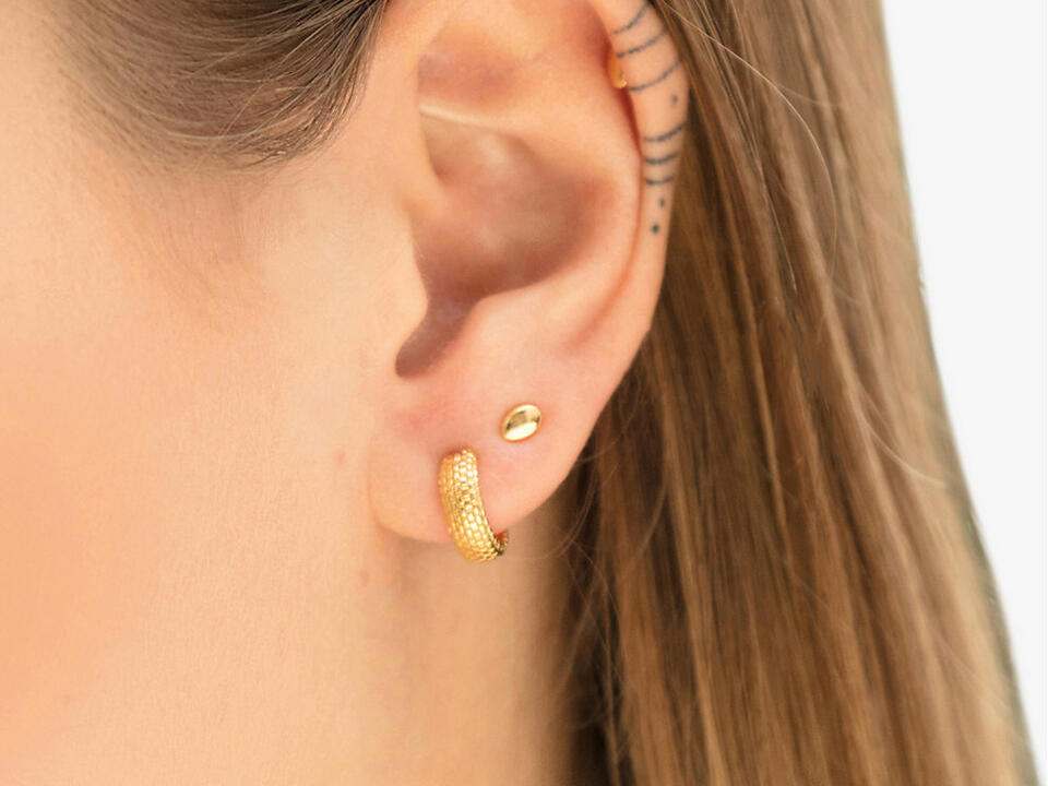 multiple lobe piercings creates a unique earring look